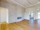 Bright living room with wood floors and a stunning fireplace at 14036 Prairie Hill Rd, Dade City, FL 33525