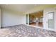 Covered patio offers indoor/outdoor living with stone flooring and views of the interior living space at 14036 Prairie Hill Rd, Dade City, FL 33525