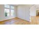 Well-lit room featuring hardwood floors and abundant natural light through large windows at 14036 Prairie Hill Rd, Dade City, FL 33525
