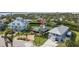 Panoramic aerial shot of a coastal property with a inviting front porch, brick driveway and landscaped yard at 505 Sally Lee Dr, Ellenton, FL 34222