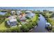 Stunning aerial view of waterfront property with pool, boat dock, lush landscaping and nearby river at 505 Sally Lee Dr, Ellenton, FL 34222