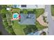Aerial top-down view showcasing a home with a backyard pool and lush green landscaping at 505 Sally Lee Dr, Ellenton, FL 34222