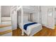 Cozy bedroom features a bunk bed, closet, and steps to the upper bunk that maximizes the room's functionality and design at 505 Sally Lee Dr, Ellenton, FL 34222