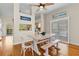 Bright dining area with wooden table, modern decor and sliding door access at 505 Sally Lee Dr, Ellenton, FL 34222