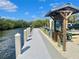 Dock featuring information kiosk, trailer, and a view of the waterway at 505 Sally Lee Dr, Ellenton, FL 34222