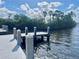A wooden dock featuring a waterway surrounded by mangrove trees with reflections in the water at 505 Sally Lee Dr, Ellenton, FL 34222