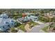 Charming single-story home with manicured lawn, brick driveway, palm trees, and inviting front porch at 505 Sally Lee Dr, Ellenton, FL 34222