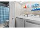 Convenient laundry area with washer, dryer, and linen closet, making laundry tasks simple and organized at 505 Sally Lee Dr, Ellenton, FL 34222