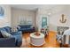 Inviting living room featuring hardwood floors, comfortable seating, and stylish decor at 505 Sally Lee Dr, Ellenton, FL 34222