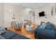 Spacious living room with high ceilings, hardwood floors, and stylish nautical decor at 505 Sally Lee Dr, Ellenton, FL 34222