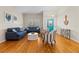 Bright living room with hardwood floors, stylish seating, and a large window with plenty of natural light at 505 Sally Lee Dr, Ellenton, FL 34222
