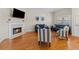Cozy living room featuring a fireplace, hardwood floors, and comfortable seating at 505 Sally Lee Dr, Ellenton, FL 34222