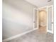 A room featuring tile flooring and glass French doors that lead into a hallway of the home at 14370 Hammock Oak St, Parrish, FL 34219