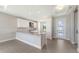 Stylish kitchen featuring a spacious island with granite countertops and modern appliances at 14370 Hammock Oak St, Parrish, FL 34219