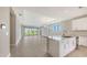 Spacious living room with tile floors, large sliding glass doors leading to the backyard, and plenty of natural light at 14370 Hammock Oak St, Parrish, FL 34219