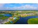 Scenic aerial view of the community featuring lakes, a pool and clubhouse at 4621 Mondrian Ct, Sarasota, FL 34240