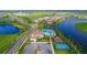 Beautiful aerial view of a Primary-planned community, featuring lakes, a pool, recreation facilities, and well-maintained homes at 4621 Mondrian Ct, Sarasota, FL 34240