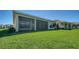 Covered lanai and spacious lawn, offering a serene outdoor living space at 4621 Mondrian Ct, Sarasota, FL 34240