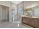 Well-lit primary bathroom with a glass shower, double sinks, and modern cabinets at 4621 Mondrian Ct, Sarasota, FL 34240