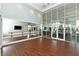 Community dance studio with wood floor, mirrors, and large windows looking into the gym at 4621 Mondrian Ct, Sarasota, FL 34240