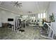 Community gym featuring a variety of exercise equipment, large windows, and TV screens at 4621 Mondrian Ct, Sarasota, FL 34240