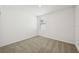 Bright, empty bedroom featuring neutral carpet and a window at 31629 Malbec Dr, Brooksville, FL 34602