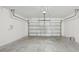 Spacious garage with concrete floor and white walls at 31629 Malbec Dr, Brooksville, FL 34602