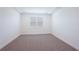 Bright bedroom featuring a window and neutral carpet at 466 Sun Chaser Dr, Nokomis, FL 34275