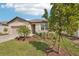 Landscaped front yard featuring a charming single-story home at 466 Sun Chaser Dr, Nokomis, FL 34275