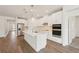 Modern kitchen with stainless steel appliances, and a large center island at 466 Sun Chaser Dr, Nokomis, FL 34275