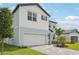 Attractive two-story home with brick paver driveway, two-car garage, and neutral color palette at 474 Sun Chaser Dr, Nokomis, FL 34275