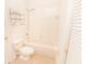 Bright bathroom featuring tile floors, toilet and a shower and tub combo at 12908 Cattail Shore Ln, Riverview, FL 33579