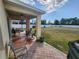 Spacious backyard with a covered patio and a large grassy area with nice sky view at 109 Tierra Verde Way, Bradenton, FL 34212