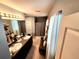 Bathroom featuring a double vanity with granite countertop and a separate shower and toilet area at 109 Tierra Verde Way, Bradenton, FL 34212