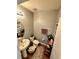Clean bathroom with a pedestal sink, modern fixtures, and stylish decorative accents at 109 Tierra Verde Way, Bradenton, FL 34212
