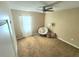 Bedroom featuring neutral walls, carpet floors, a ceiling fan, and ample natural light at 109 Tierra Verde Way, Bradenton, FL 34212