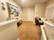 Upstairs hallway that features neutral walls, carpet floors, and artwork at 109 Tierra Verde Way, Bradenton, FL 34212