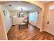 Bright living room featuring wood-look floors, an arched doorway, and stylish decor at 109 Tierra Verde Way, Bradenton, FL 34212
