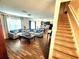 Open-concept living room with tile floors that flows seamlessly into the kitchen and dining area at 109 Tierra Verde Way, Bradenton, FL 34212