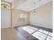 Inviting living room with lots of light and modern chandelier at 14248 Salvatierra Ln, Port Charlotte, FL 33981