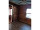 Cozy bedroom with wood-paneled walls, laminate floors, and whimsical ceiling decor at 718 New York St, Clearwater, FL 33756
