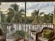 Enjoy this screened lanai with great view of the water, tropical plants, and boat docks at 3233 Purple Martin Dr # 121, Punta Gorda, FL 33950