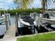 Boat dock on a canal with a boat lift, offering convenient water access at 3233 Purple Martin Dr # 121, Punta Gorda, FL 33950
