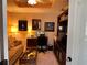 Cozy home office with a ceiling fan, a comfortable sofa, and a built-in bookcase, creating a productive workspace at 3233 Purple Martin Dr # 121, Punta Gorda, FL 33950