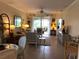 Inviting living room with comfortable seating, a ceiling fan, tile flooring, and access to a screened-in patio at 3233 Purple Martin Dr # 121, Punta Gorda, FL 33950