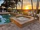 Outdoor pool and hot tub with brick surround, ideal for relaxation and entertainment at 3233 Purple Martin Dr # 121, Punta Gorda, FL 33950