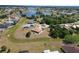 Expansive aerial view of a waterfront property showcasing the home's location, landscaping, and lake access at 1147 Yachtsman Ln, Punta Gorda, FL 33983