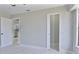 Spacious bedroom features a light-gray color palette and pristine tile floors at 1147 Yachtsman Ln, Punta Gorda, FL 33983