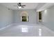 Light and bright bedroom with tile flooring, neutral paint, and updated lighting at 1147 Yachtsman Ln, Punta Gorda, FL 33983
