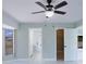 Secondary bedroom offers tile floors, ceiling fan and updated lighting at 1147 Yachtsman Ln, Punta Gorda, FL 33983